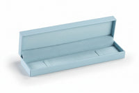 A light blue leatherette bracelet box is open and empty, with a suede interior, displayed on a neutral background.