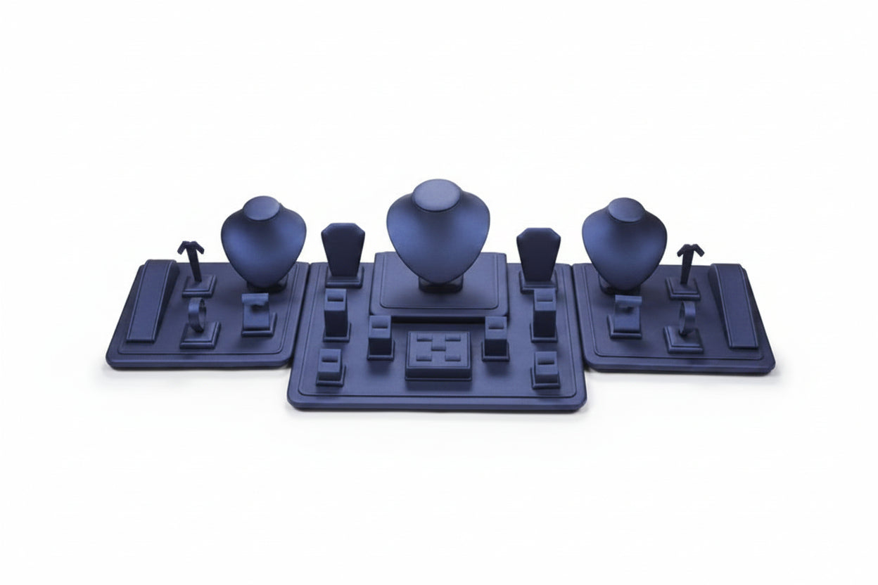 Set of blue jewelry display stands on a white background