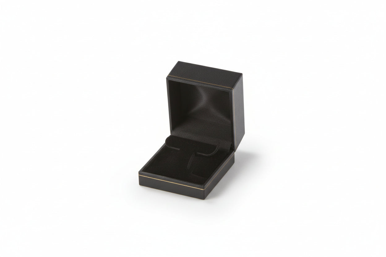 A black leatherette earring tree box with gold rim, opened to show the interior compartment, set against a plain background.