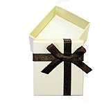 A beige cardboard earring box with a chocolate-colored ribbon bow on top.
