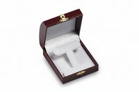A leatherette domed earring tree box open and empty, with a velvet insert and a gold accent clasp.
