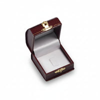 A leatherette domed ring clip box with a gold accent clasp, open and empty, revealing a velvet interior.