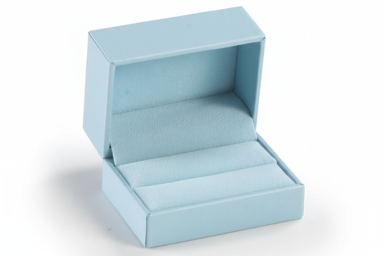 A light blue leatherette double ring slit box is open and empty, displaying its interior with a light blue suede lining.