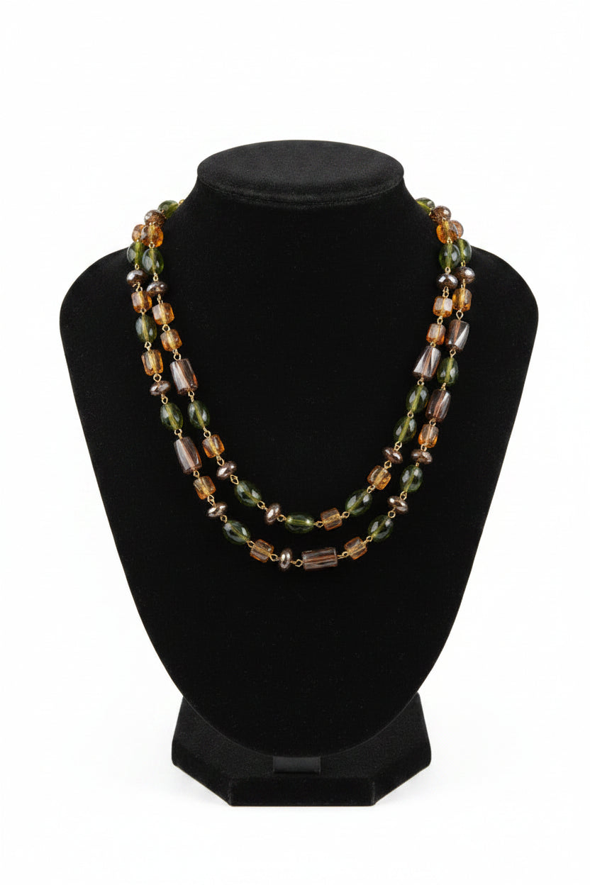 Multicolored beaded necklace on a Black Velvet display stand