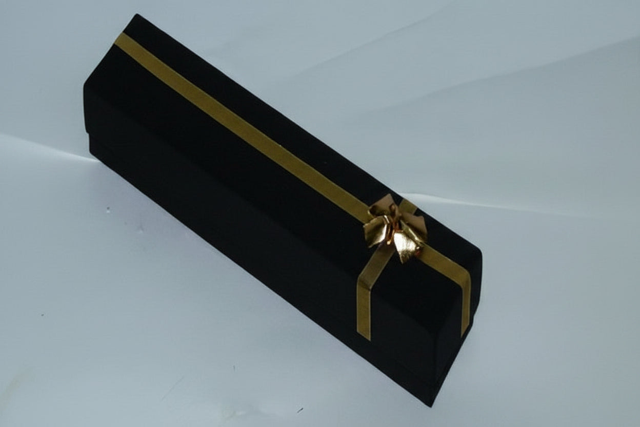 Black gift box with a gold ribbon