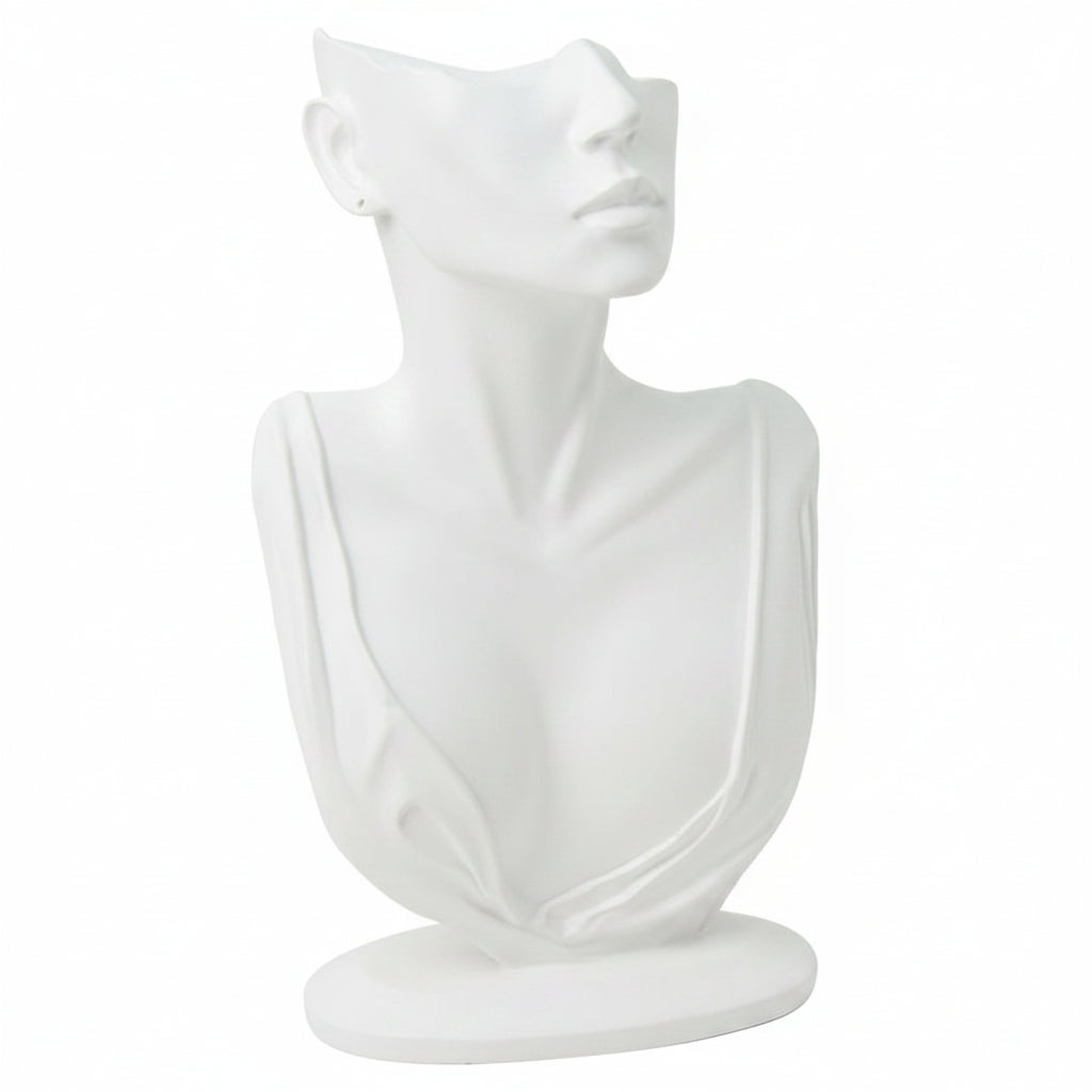 Black abstract sculpture of a draped figure on a white background